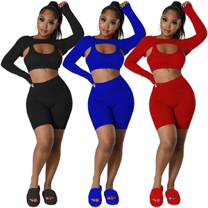 Three-piece athletic set for women with long sleeve shrug crop top bra and biker shorts