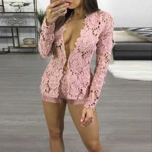 Close-up of pink lace two-piece set featuring intricate hollow embroidery and deep V-neck