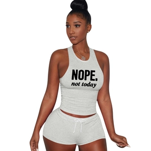 Detail of grey cotton two-piece sports set with black NOPE and not today print design