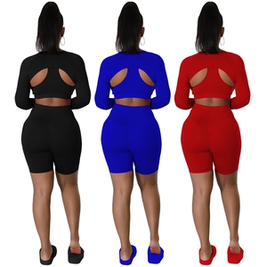 Women's 3-piece athletic set featuring backless long sleeve crop top and biker shorts