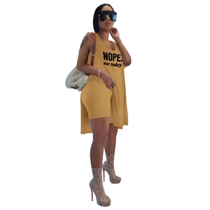 Detail of longline graphic tank top and shorts set in ginger with side slits