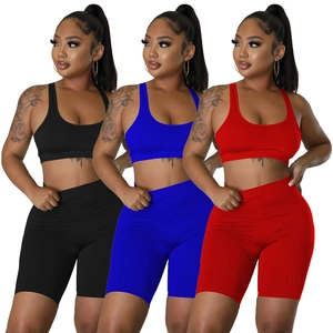 Women's 2-piece high-waisted workout set with sports bra and biker shorts in multiple colors