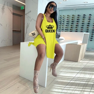 Detail view of yellow two-piece set featuring Queen lettering and crown print design