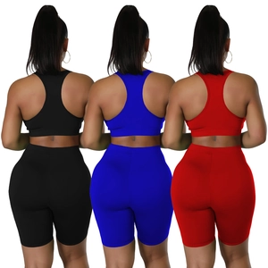 Women's 3-piece athletic set with racerback crop top and high waist biker shorts