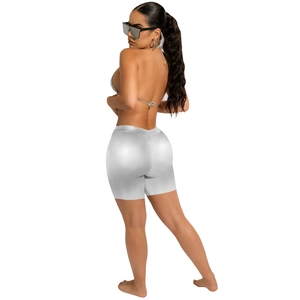 Metallic silver bikini top and high-waist biker shorts set with a backless tied design