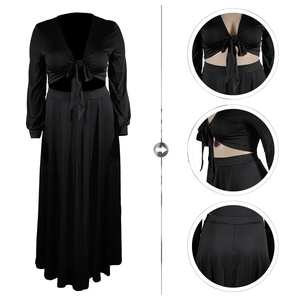 Dettaglio del set nero a due pezzi con top allacciato scollo a V e gonna lunga a vita alta