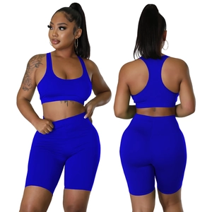 Front and back view of royal blue ribbed sports bra and high-waisted shorts set