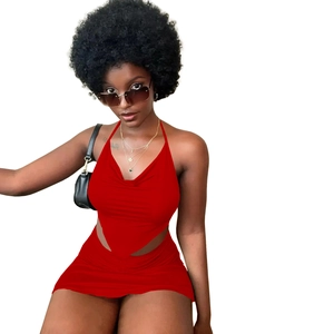 Detail of red halter neck top and bodycon skirt set with draped neckline and slimming fit