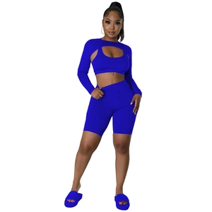 Detail of Klein blue 3-piece sports set with cropped shrug, vest and high waist shorts