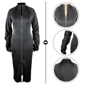Detail view showing a sleek black dress with a double-ended zipper and ruched sleeves