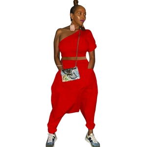 Detail of red off-shoulder cotton top and harem pants set with functional pockets