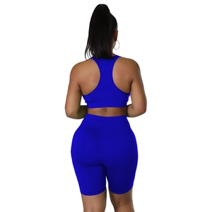 Rear view of cobalt blue racerback sports bra and high-waisted shorts fitness set