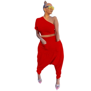 Detail of red off-shoulder crop top and harem pants with large side pockets