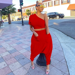 Detail view of the red cotton blend two-piece set with side pockets and harem style pants
