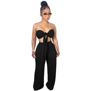 Ensemble noir deux pièces pour femme avec top court à nouer et pantalon large à taille haute
