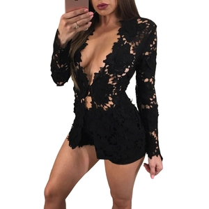 Close-up of black floral lace fabric with intricate patterns on a deep V-neck romper