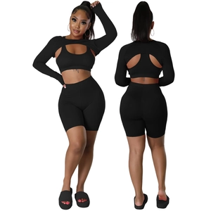 Three-piece black sports set featuring high-waisted shorts, crop top, and long sleeve shrug