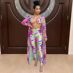 Detailed close-up of tiger print and floral pattern on women's pink three-piece set