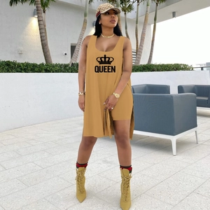 Detail of yellow two-piece set featuring sleeveless long vest with Queen crown print