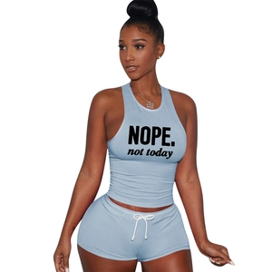 Detail of light blue cotton sports set featuring 'NOPE' print and drawstring shorts