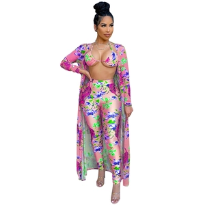 Three-piece women's tiger print swimsuit set with long pants and matching open cardigan
