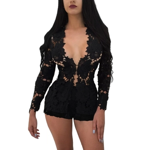 Close-up of black lace floral pattern and scalloped edges on long-sleeve V-neck set