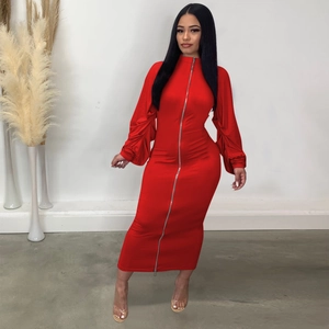 Close-up of the silver dual-ended metal zipper on this red long-sleeve bodycon dress