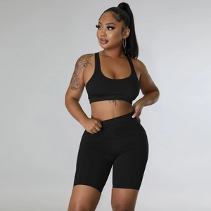 Close-up of black sports bra and biker shorts set in high-elasticity quick-dry fabric