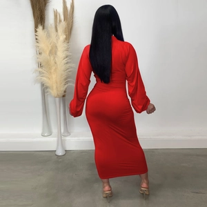 Detailed back view of a slim fit red floor-length dress with ruched long sleeves
