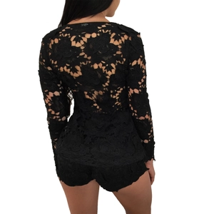 Back view of black floral lace two-piece set featuring long sleeves and matching shorts