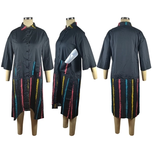 Detail view of black shirt dress featuring colorful artistic line print and large pockets