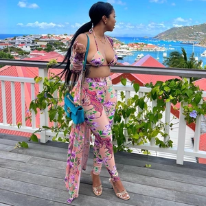 Detailed tiger and floral print on three-piece pink resort wear set including a belt