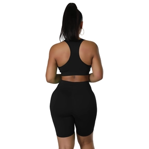 Back view of black high-waist cycling shorts and matching sports bra athletic set
