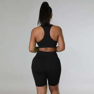 Back view of high-elastic black yoga set including sports bra and cycling shorts