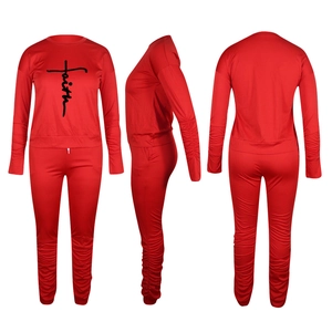 Red faith print tracksuit set with shirring details on sleeves and pants in three views