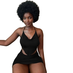 Detail of black two-piece set featuring a halter crop top and high-waisted bodycon skirt