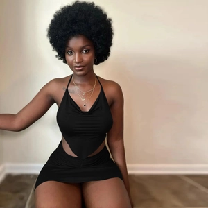 Close-up of black two-piece set featuring halter neck top and bodycon mini skirt