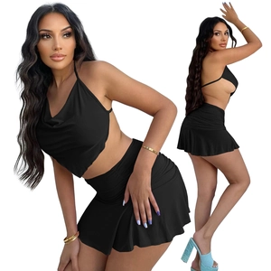 Detailed view of women's black two-piece set with halter crop top and ruched mini skirt