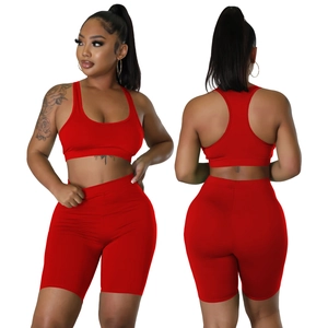 Front and back views of vibrant red athletic two-piece set with racerback bra and shorts