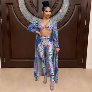 Three-piece purple floral set with tiger print blouse and pants including belt detail