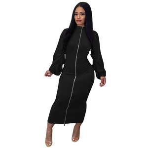 Detail of a slim-fit black maxi dress with two-way zipper and ruched sleeve texture