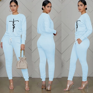 Three-way view of light blue loungewear set with faith lettering and drawstring pants