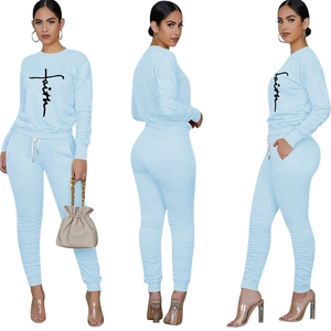 Detail view of Faith cross print on light blue sweatshirt and drawstring joggers set
