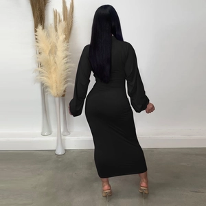 Rear view of a slim-fit black maxi dress with long sleeves and pleated cuff detailing