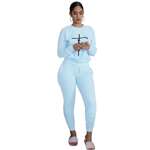 Detail of the light blue loungewear set with faith print and side ruched jogger pants