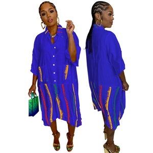 Royal blue shirt dress with rainbow stripes and two large pockets in boho ethnic style
