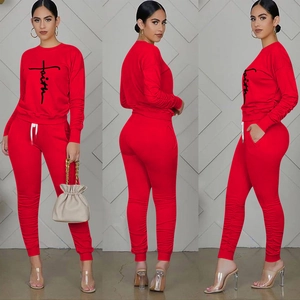 Front and back views of a red long sleeve lounge set with black faith script print