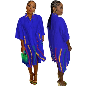 Detailed view of women's royal blue maxi shirt dress with abstract art print and large pockets