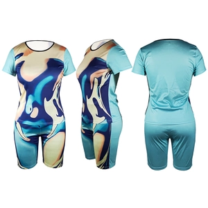 Three-way view of tie-dye short sleeve top and biker shorts set with abstract blue print