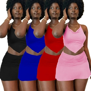 Women's two-piece skirt set with halter crop top and ruched mini skirt in four colors